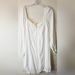 White With Ruffle Trim Peasant Style Dress In White.